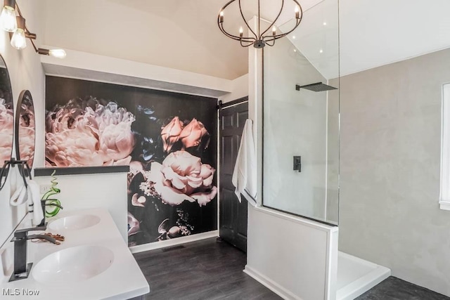 bathroom with visible vents, wood finished floors, an enclosed shower, a chandelier, and a sink
