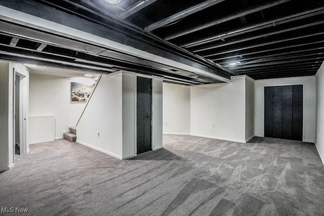 finished below grade area with carpet floors and stairway