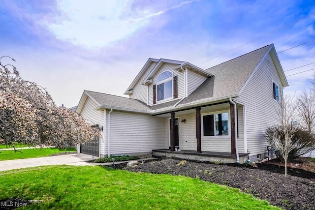 traditional-style house with a garage, a front lawn, a shingled roof, a porch, and driveway