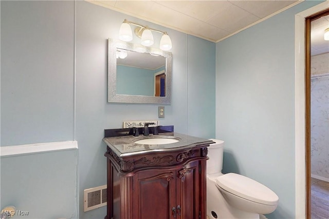441 4th St, Bergholz, OH 43908 - half bath with crown molding, toilet, visible vents, and vanity