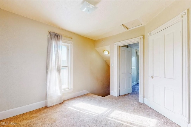 441 4th St, Bergholz, OH 43908 - unfurnished bedroom with carpet floors, attic access, and baseboards