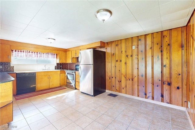 441 4th St, Bergholz, OH 43908 - kitchen with visible vents, wood walls, decorative backsplash, and stainless steel appliances