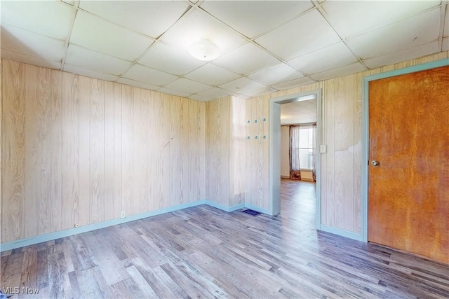 441 4th St, Bergholz, OH 43908 - unfurnished room with wood walls, wood finished floors, and a paneled ceiling