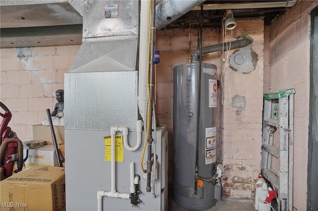 utility room featuring water heater and heating unit