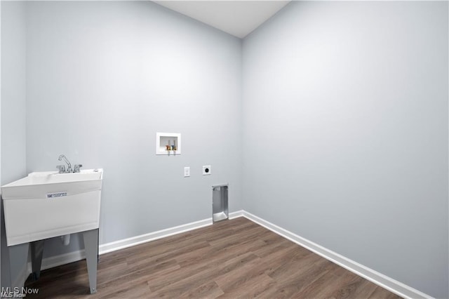 washroom with laundry area, electric dryer hookup, baseboards, hookup for a washing machine, and dark wood-type flooring