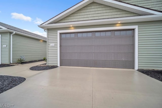 garage featuring driveway