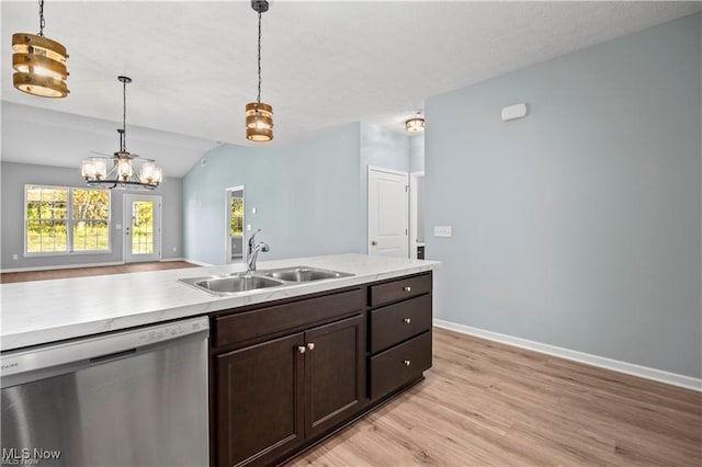 kitchen with dark brown cabinetry, stainless steel dishwasher, light wood-type flooring, a sink, and baseboards