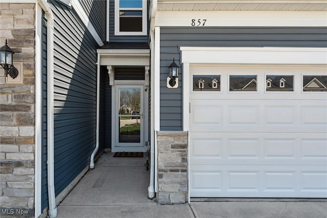 entrance to property featuring stone siding