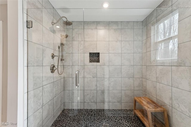 bathroom featuring a stall shower and recessed lighting