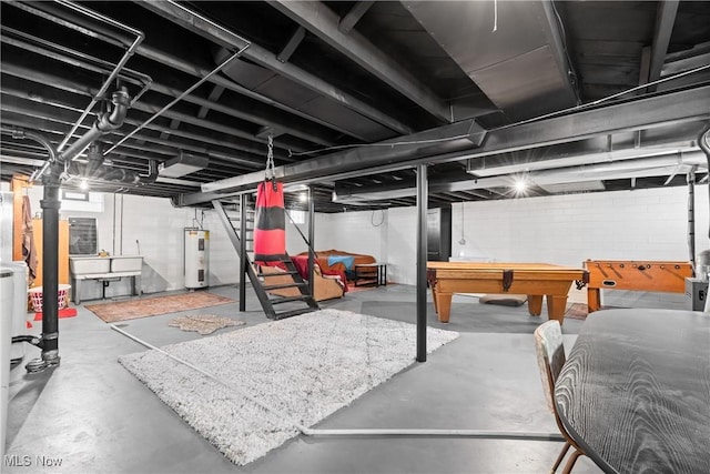 unfinished basement featuring billiards and electric water heater