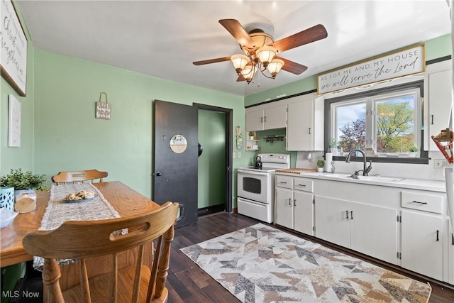 kitchen with white cabinets, white range with electric stovetop, ceiling fan, a sink, and light countertops