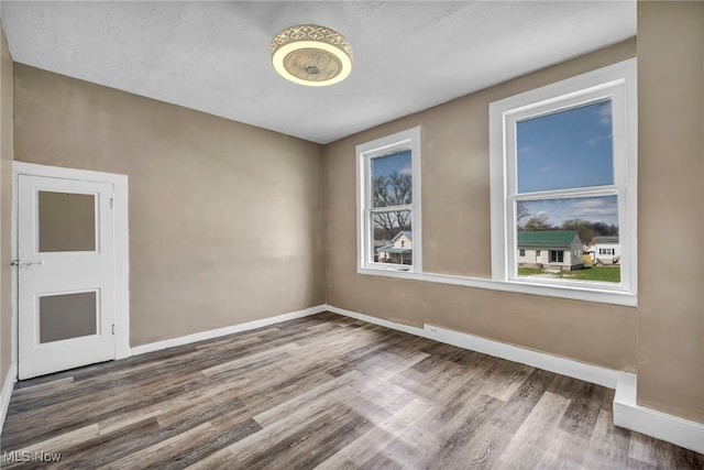 8935 S Main St, Windham, OH 44288 - unfurnished room with baseboards and wood finished floors