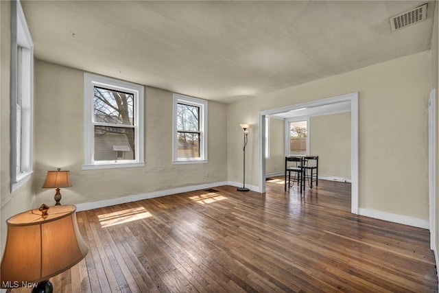 8935 S Main St, Windham, OH 44288 - spare room with visible vents, baseboards, and hardwood / wood-style floors