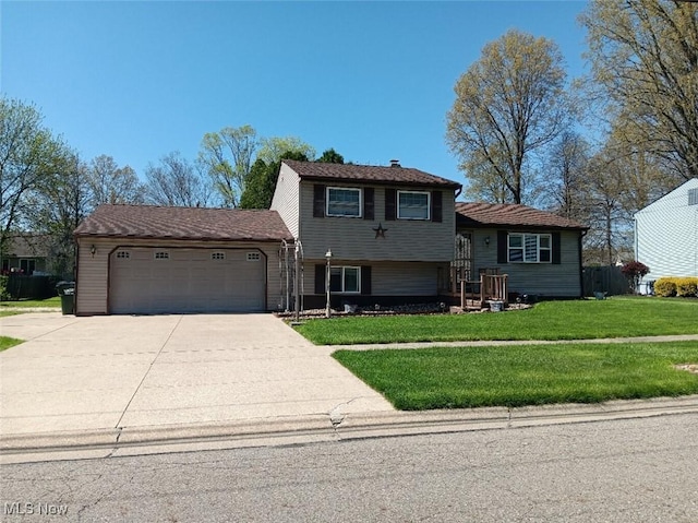 split level home featuring a garage, driveway, and a front lawn