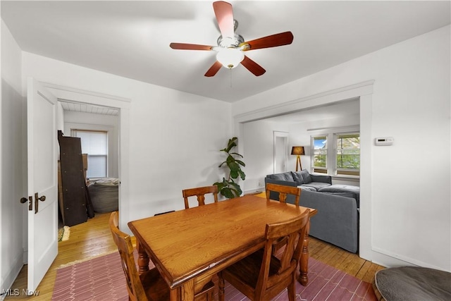 dining area featuring ceiling fan and wood finished floors