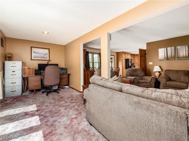 living room featuring light colored carpet and baseboards