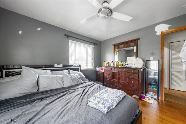 bedroom featuring ceiling fan and wood finished floors
