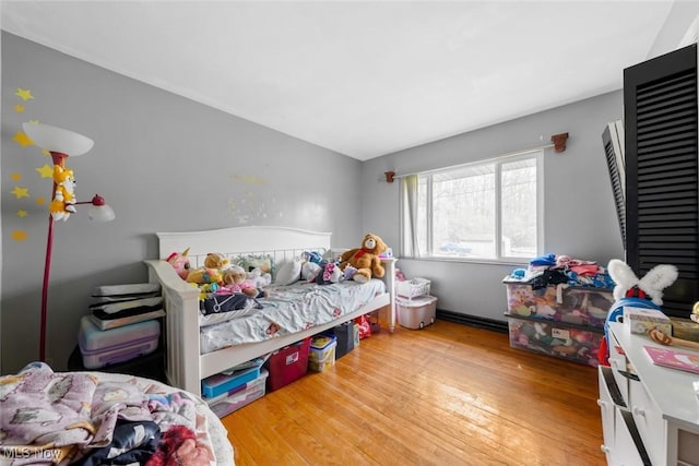 bedroom with wood finished floors