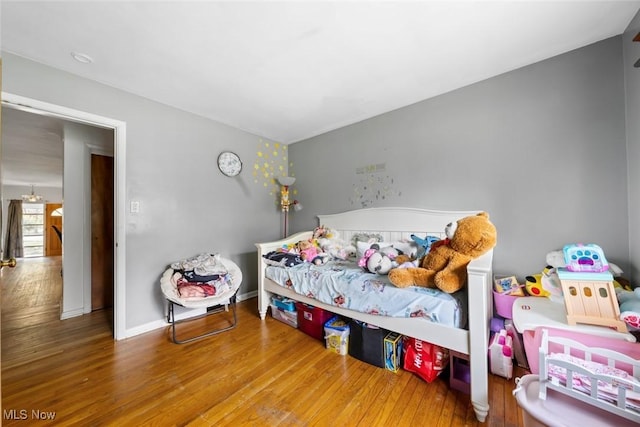 bedroom with wood finished floors