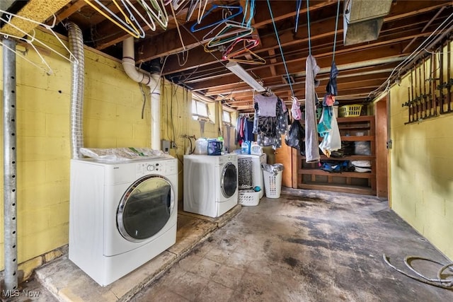 clothes washing area featuring laundry area and washer and dryer