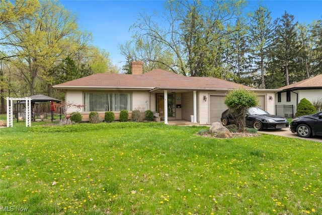ranch-style home featuring an attached garage, a chimney, and a front lawn