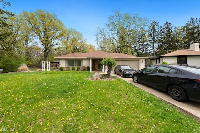 single story home with a garage, a chimney, driveway, and a front yard