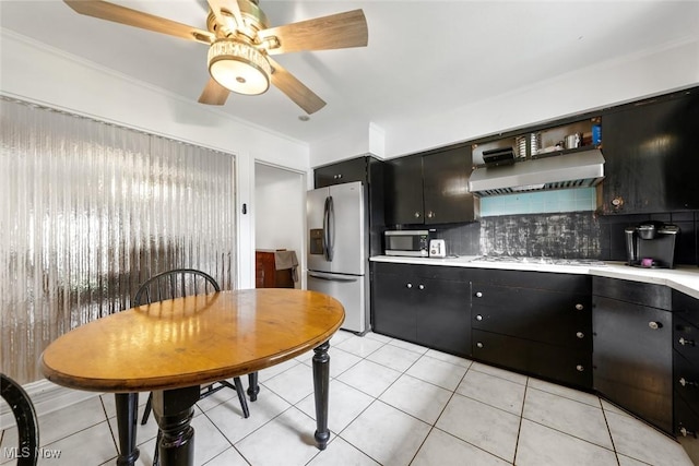 kitchen featuring dark cabinets, light countertops, ceiling fan, and stainless steel appliances