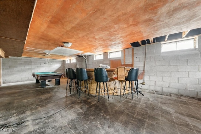 interior space featuring billiards and concrete flooring
