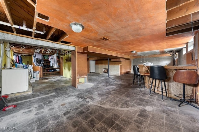 interior space featuring visible vents and washer / dryer