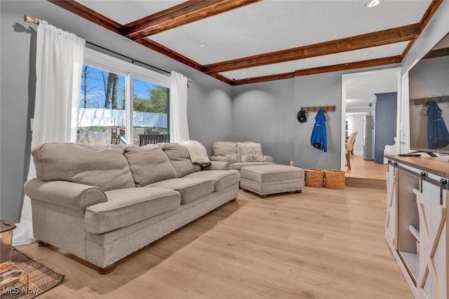 living area with light wood-style floors, recessed lighting, and beam ceiling