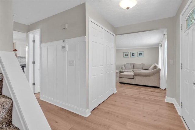 hallway with light wood-style flooring