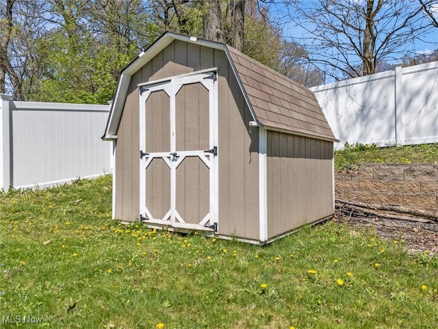view of shed featuring a fenced backyard