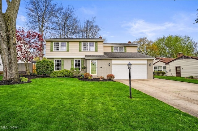 view of front of property with brick siding, driveway, a front yard, and a garage