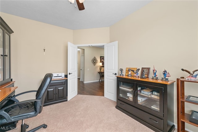 office space featuring ceiling fan and carpet