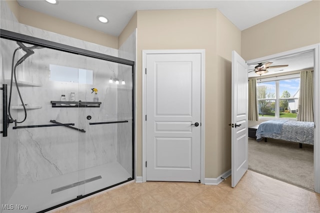 ensuite bathroom featuring ceiling fan, baseboards, a marble finish shower, ensuite bathroom, and recessed lighting