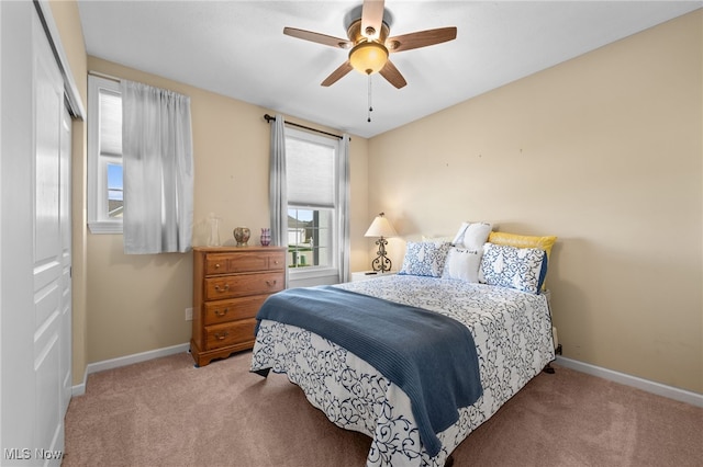 bedroom with carpet flooring, baseboards, and ceiling fan