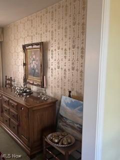interior space with wallpapered walls
