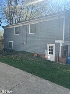 view of home's exterior featuring a yard