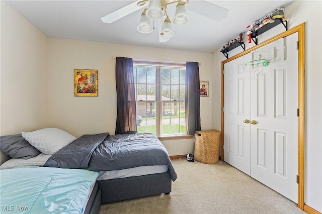409 Pin Oak Pl, Campbell, OH 44405 - carpeted bedroom featuring baseboards, ceiling fan, and a closet
