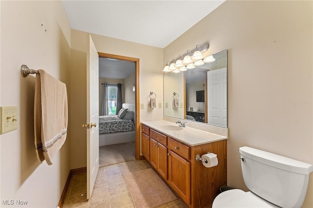 409 Pin Oak Pl, Campbell, OH 44405 - ensuite bathroom with vanity, tile patterned flooring, ensuite bath, and toilet
