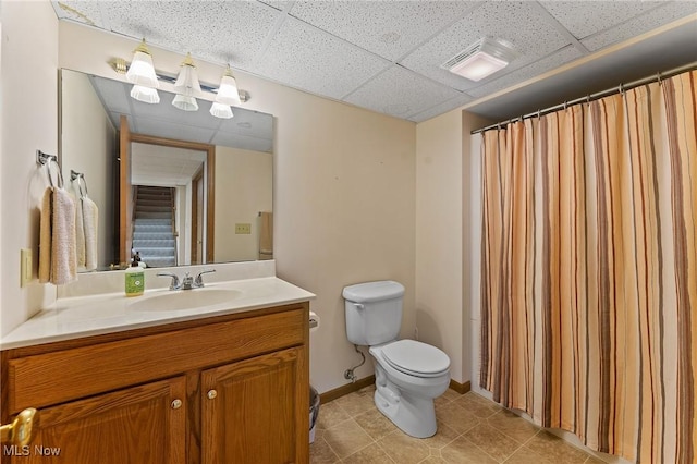 409 Pin Oak Pl, Campbell, OH 44405 - full bathroom featuring visible vents, a paneled ceiling, vanity, tile patterned floors, and toilet