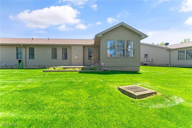 409 Pin Oak Pl, Campbell, OH 44405 - back of house featuring a yard and crawl space