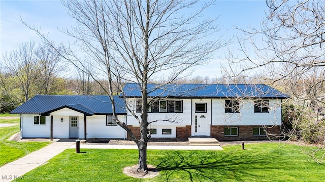 6084 Clay St, Thompson, OH 44086 - split foyer home featuring metal roof and a front yard