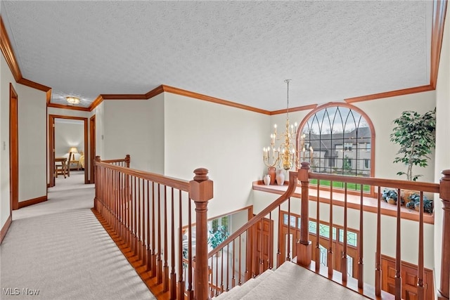 275 Camden Ln, Aurora, OH 44202 - hall featuring crown molding, carpet, a chandelier, and an upstairs landing