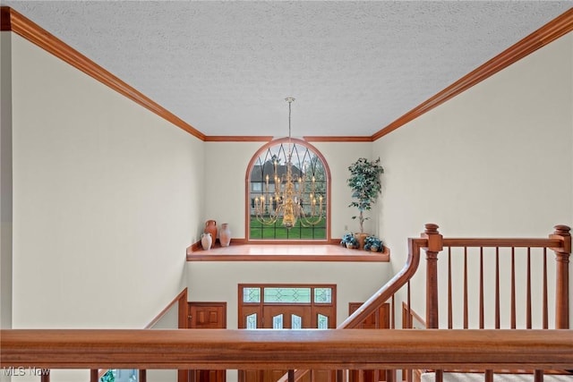 275 Camden Ln, Aurora, OH 44202 - stairway with a textured ceiling, ornamental molding, and a wealth of natural light