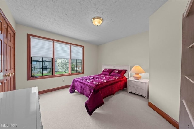 275 Camden Ln, Aurora, OH 44202 - carpeted bedroom featuring baseboards and a textured ceiling