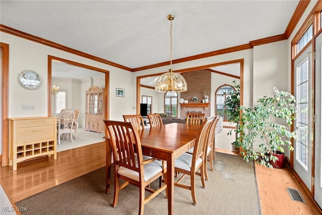 275 Camden Ln, Aurora, OH 44202 - dining space with a wealth of natural light, visible vents, wood finished floors, and a notable chandelier