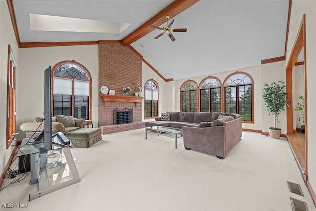 275 Camden Ln, Aurora, OH 44202 - carpeted living area with ceiling fan, visible vents, a fireplace, beam ceiling, and high vaulted ceiling