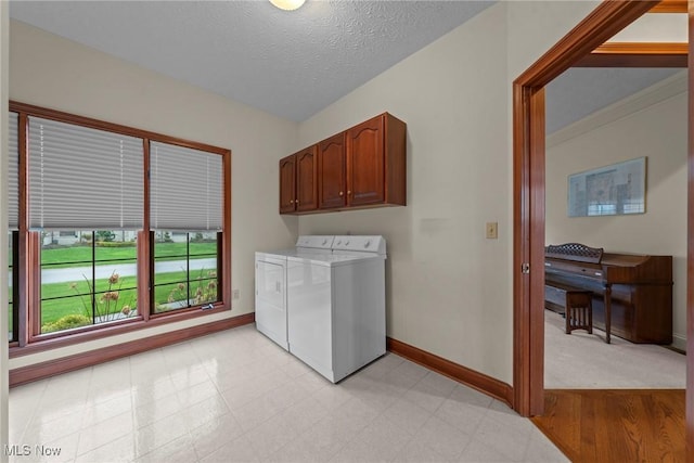 275 Camden Ln, Aurora, OH 44202 - laundry area with separate washer and dryer, cabinet space, baseboards, and light floors