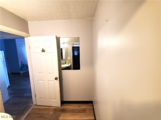 9615 Dunlap Ave, Cleveland, OH 44105 - hall featuring a textured ceiling and wood finished floors